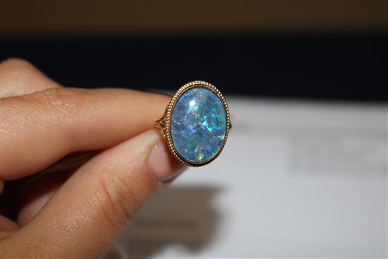 A 9ct gold black opal doublet ring